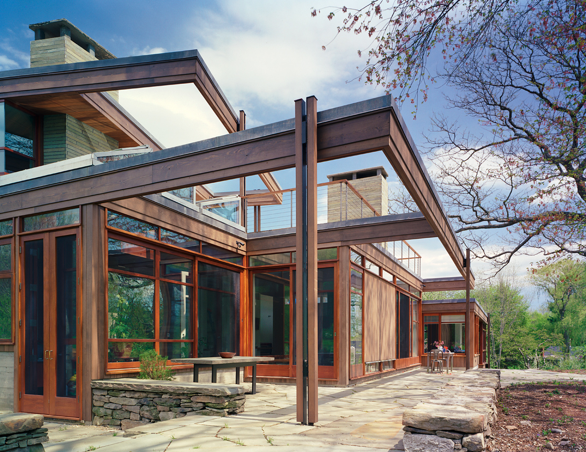 sculptural opening up of back side with wood windows and shade structures, wood-clad modern house, Greater Boston, MA