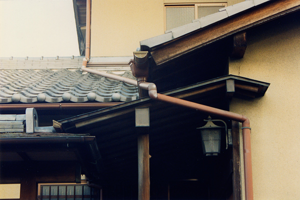 roofs on top of roofs and intersecting downspouts in Gion, Kyoto
