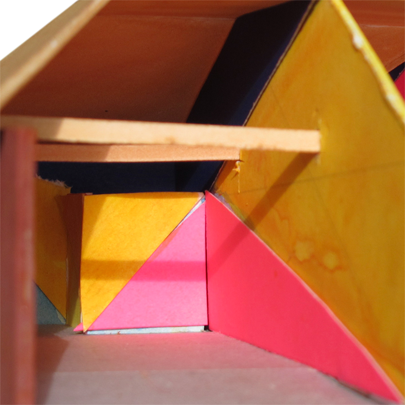 Zoom in on model showing triangulated areas of color, mainly yellow and reddish-magenta.
